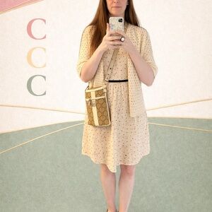 Cream Crochet Cardigan Sweater + Coach Signature Crossbody Bag